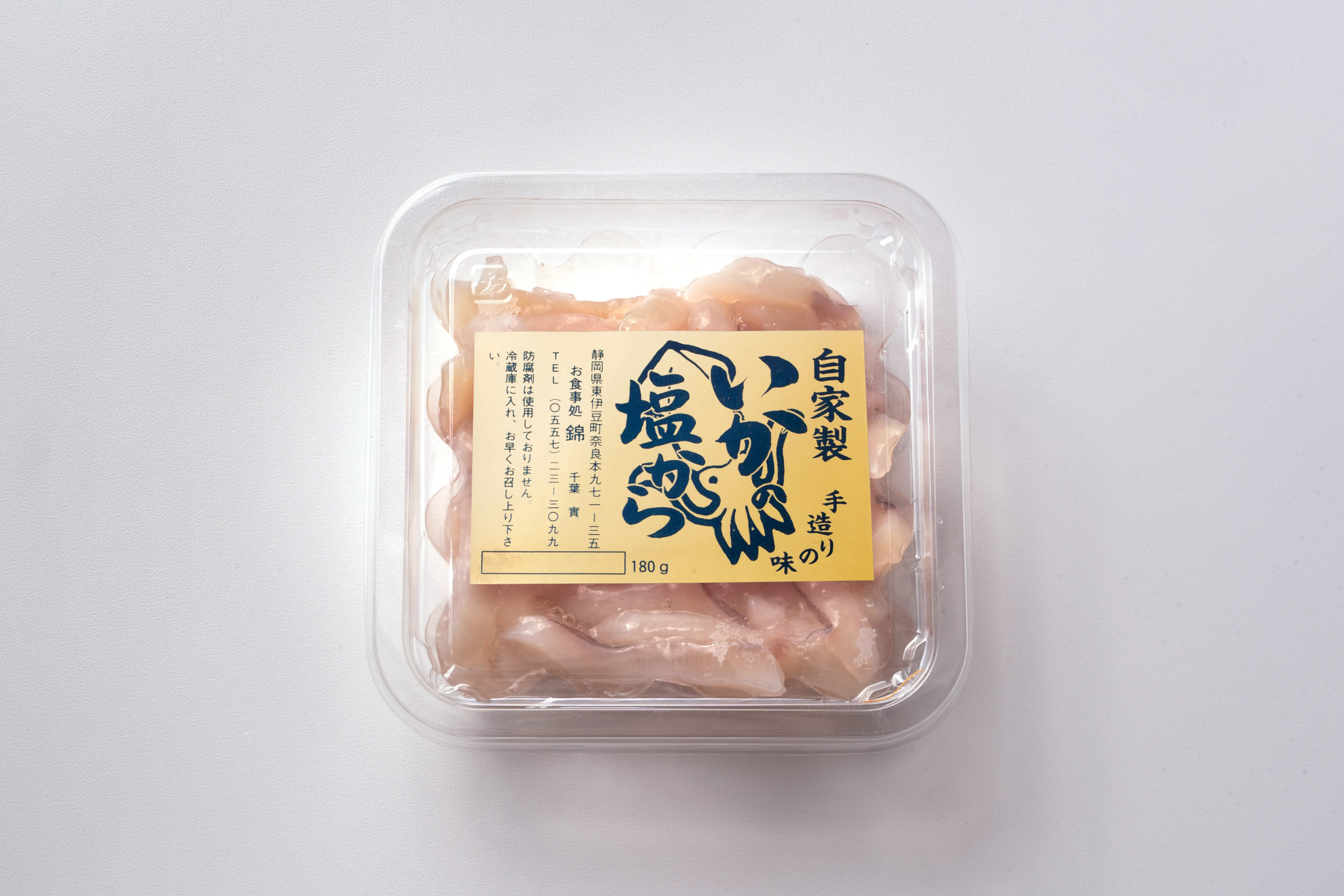 撮影用の透明惣菜パックに貼ったいか塩辛用金ホイルシール